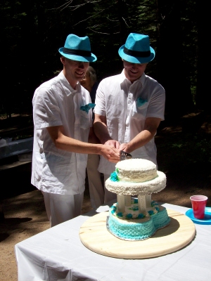 Andrew J. Wharton and Dave Clingman cut the cake created by Joann Swallow at their Commitment Ceremony